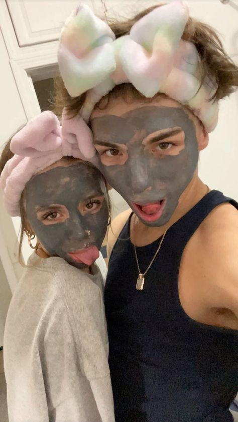 A couple having a playful skincare night together